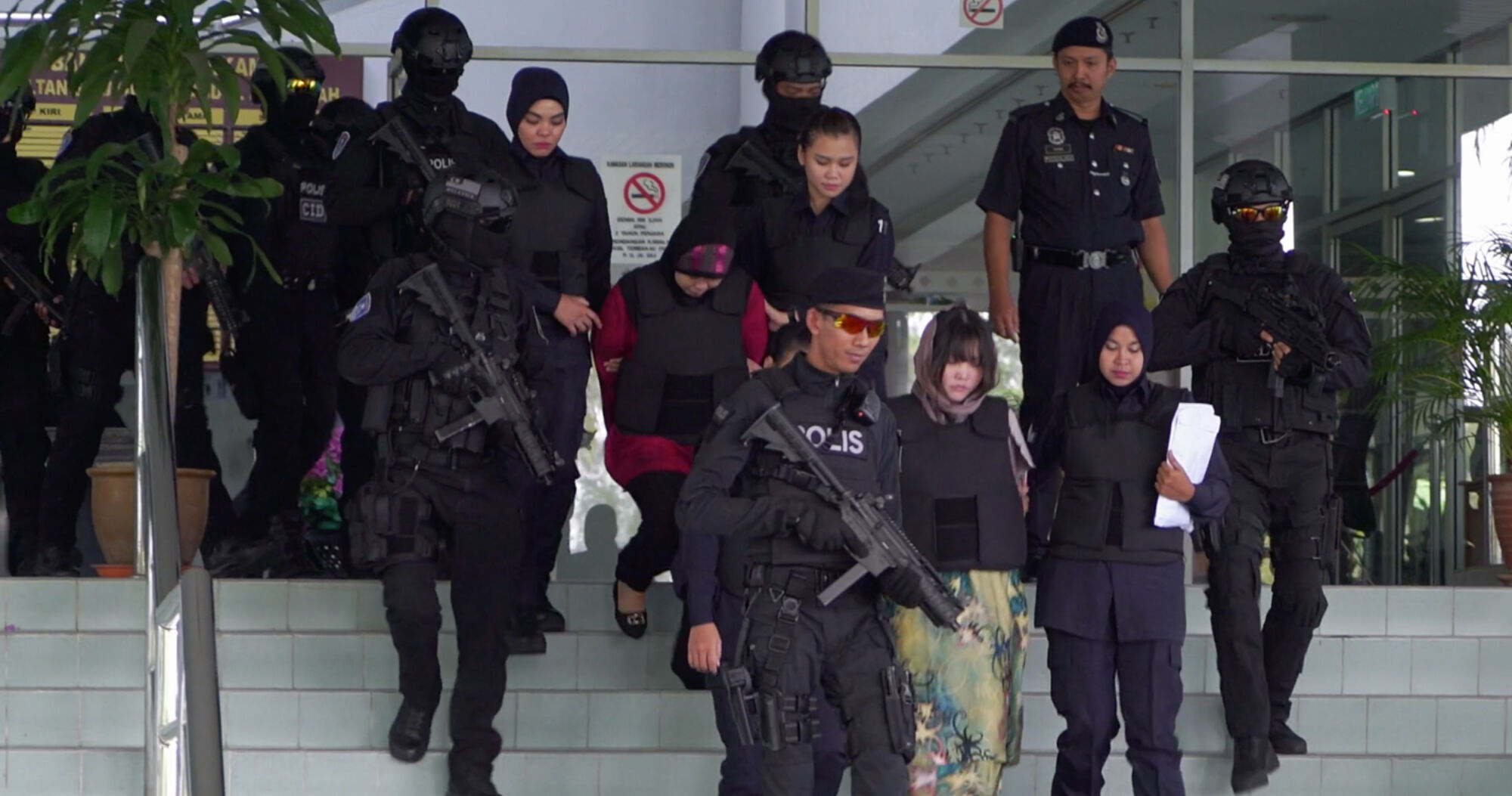 Assassins doan thi huong and siti aisyah escorted out of the courthouse by armed guards